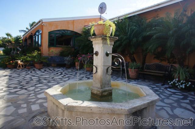 Center courtyard fountain in Palm Court Gardens in Basseterre St Kitts.jpg
