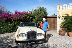 Darwin and daddy next to Rolls Royce at Palm Court Gardens in Basseterre St Kitts.jpg
