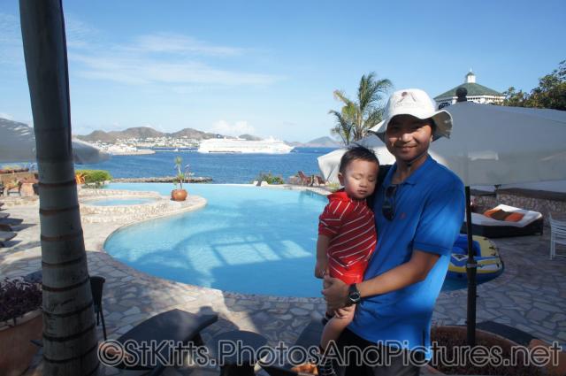 Darwin being held by daddy at Palm Court Gardens in Basseterre St Kitts.jpg
