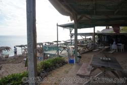 Tables and seats and beach and ocean at Shipwreck bar grill in St Kitts.jpg