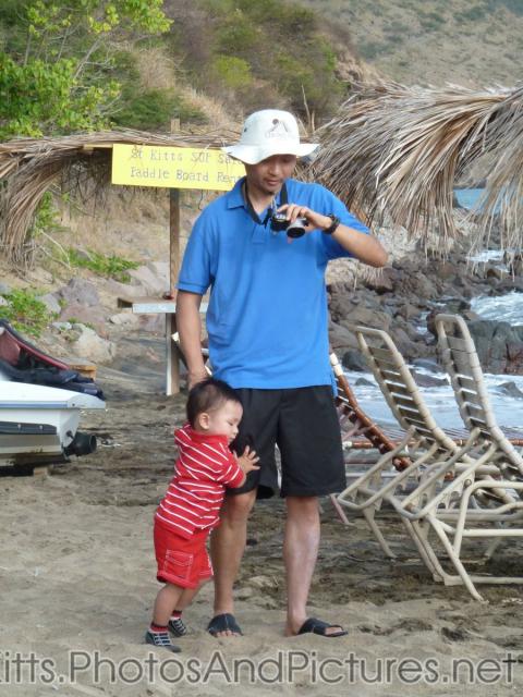Darwin holds on to daddy at the Shipwreck Bar & Grill in St Kitts.jpg
