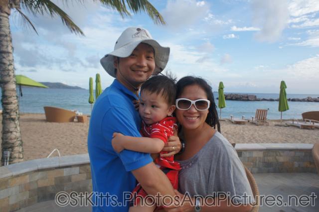 Darwin between daddy and mommy at Carambola Restaurant in St Kitts.jpg
