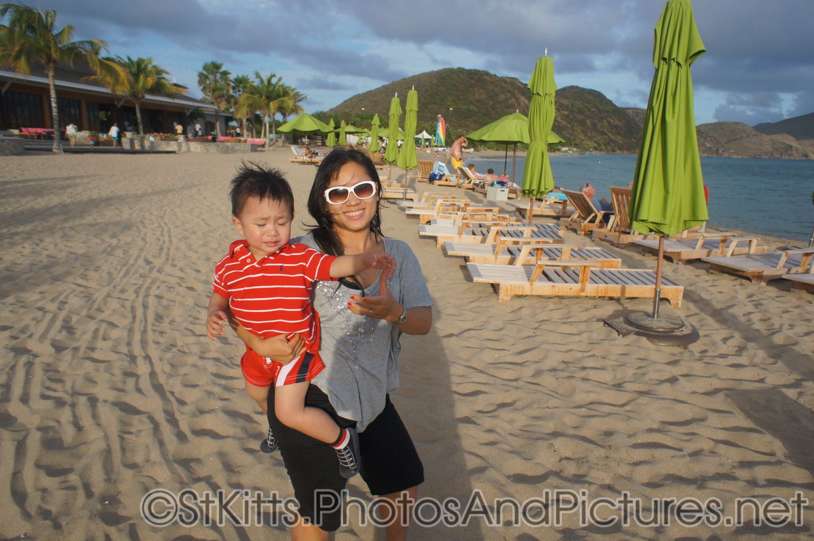 Darwin looking upset as mommy holds him at beach behind Carambola Restaurant in St Kitts.jpg
