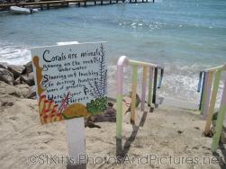Corals warning sign at Monkey Bar Beach in St Kitts.jpg