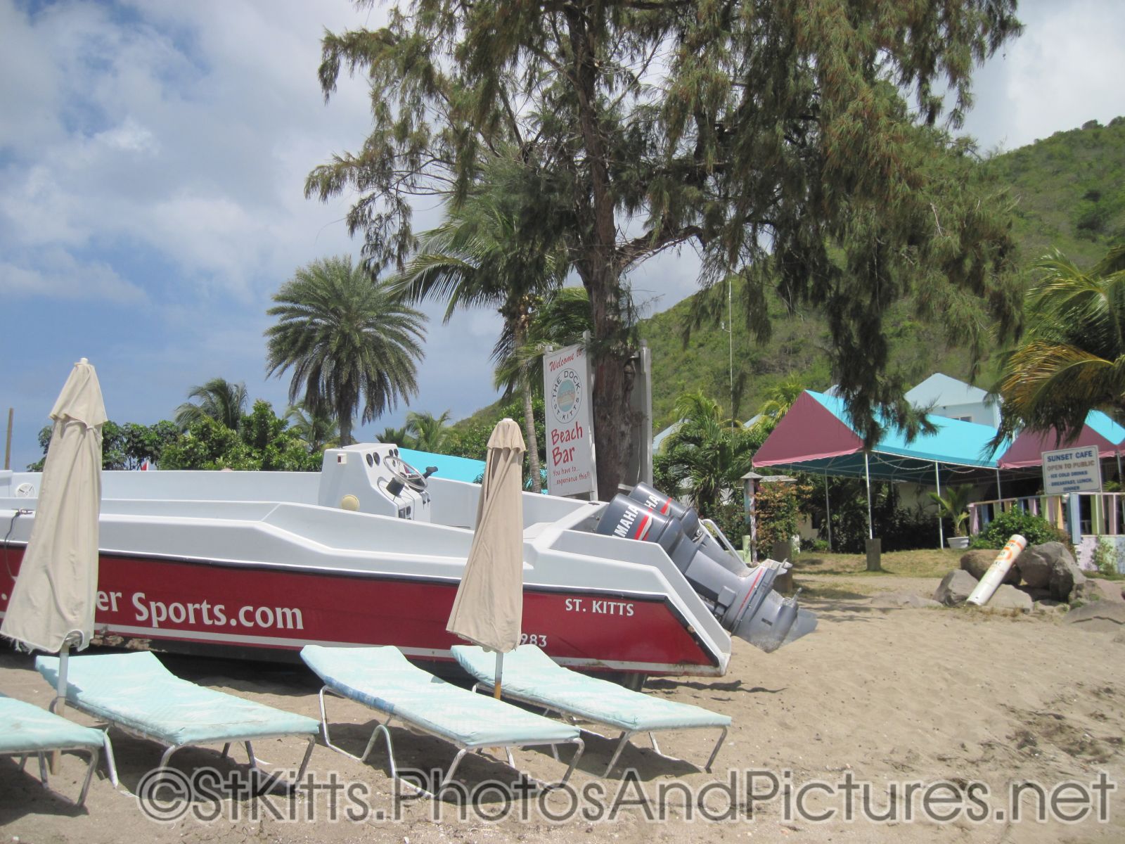 Motor boat parked on beach of Monkey Bar Beach in St Kitts.jpg
