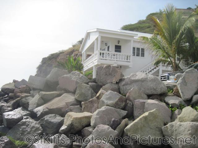 House in white at end of Monkey Bar Beach in St Kitts.jpg