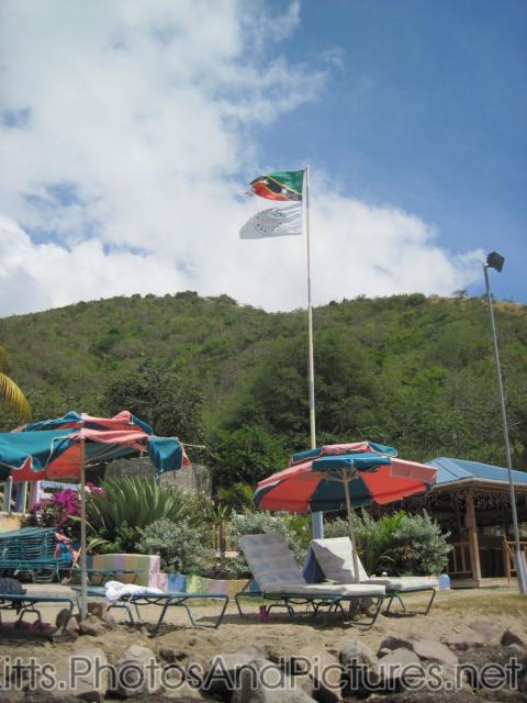 St Kitts flag and The Dock flag at Monkey Bar Beach in St Kitts.jpg
