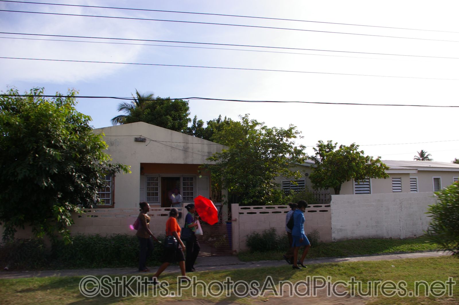 People of St Kitts walking on a sidewalk.jpg
