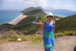 Joann at a hill top with view of ocean and sea in St Kitts.jpg