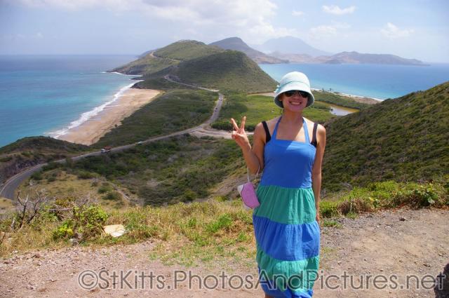 Joann at a hill top with view of ocean and sea in St Kitts.jpg
