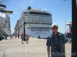 David  stands in front of the Norwegian Dawn docked at  Port Zante in St Kitts.jpg
