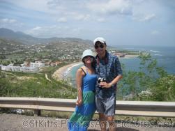 David and Joann with Frigate Beach in the background in St Kitts.jpg