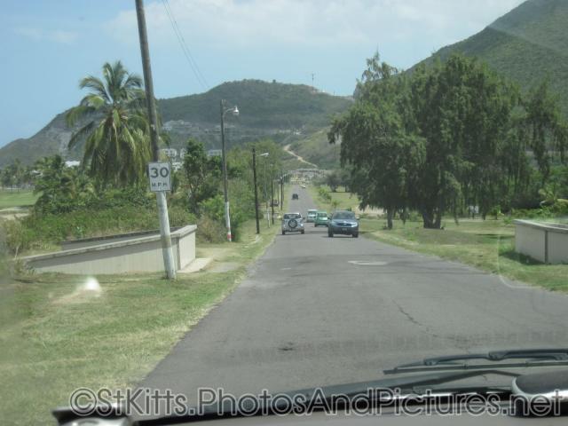 Driving down a road in St Kitts on the left side.jpg
