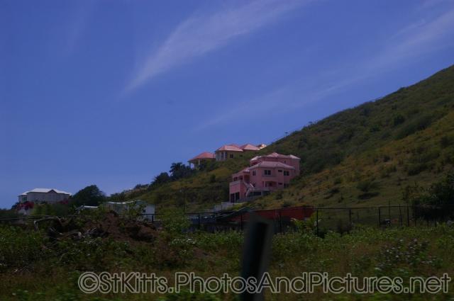 Pink large homes in hills of St Kitts.jpg
