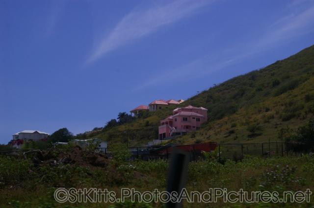 Pink large homes in hills of St Kitts.jpg