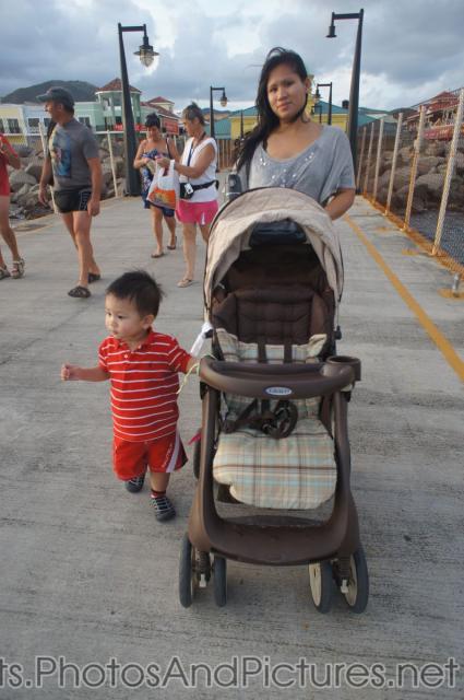 Darwin and mommy walking back to Norwegian Dawn on cruise pier in Port Zante St Kitts.jpg
