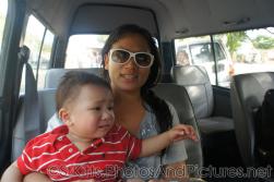 Darwin looks unhappy as mommy holds him in tour van in St Kitts.jpg