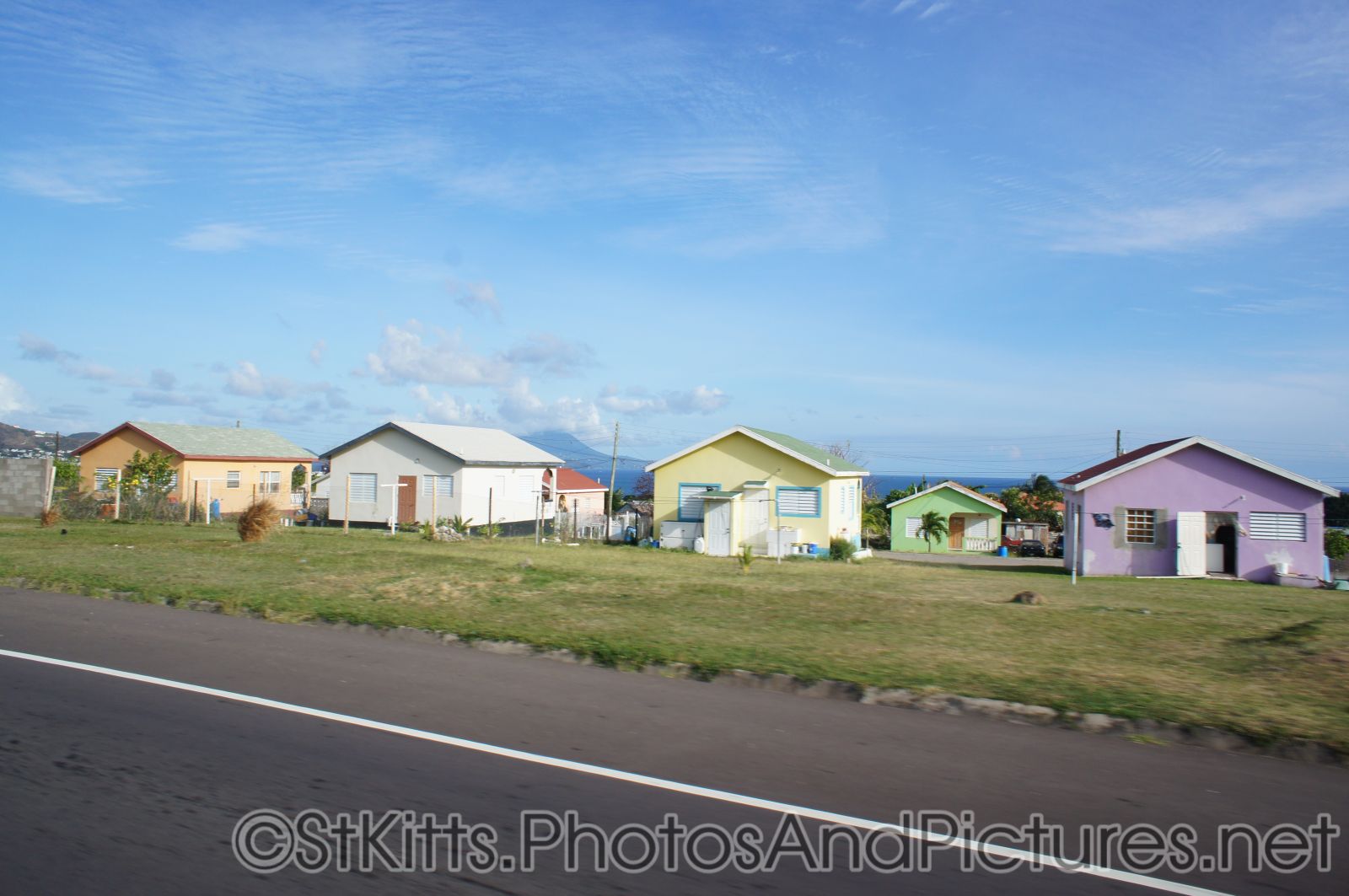 Several homes with colorful paint in St Kitts.jpg
