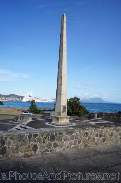 War memorial monument in St Kitts with cruise ship in background.jpg